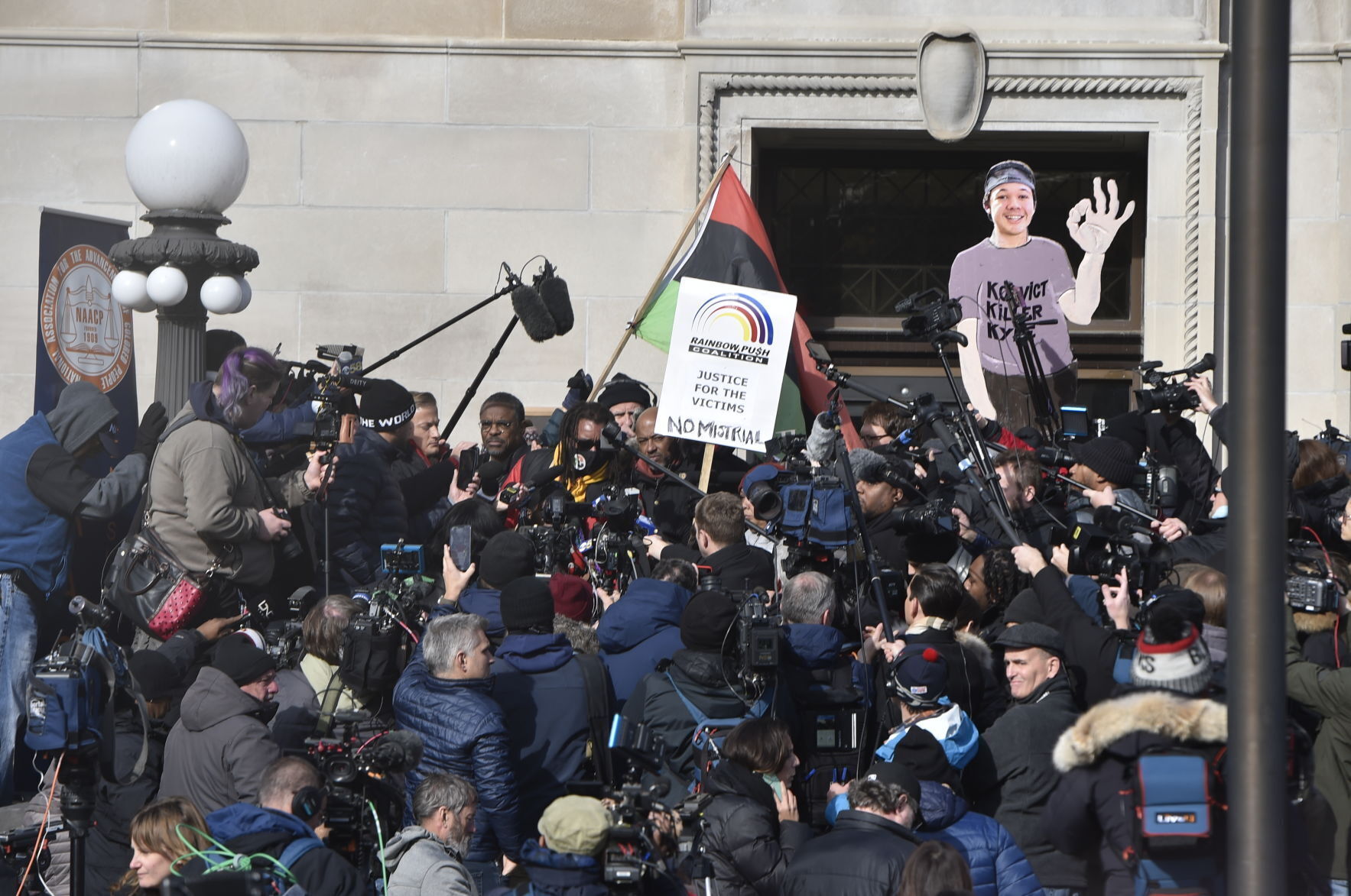 Media, activists crowd Kenosha County Courthouse steps